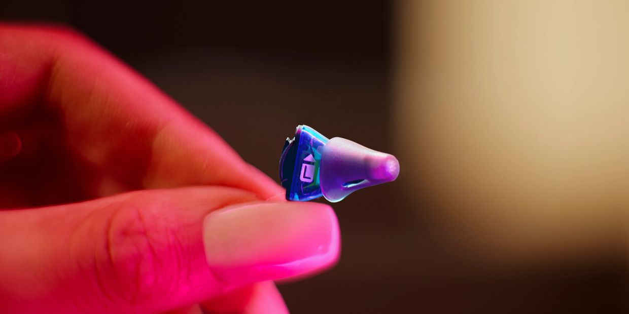 Invisible hearing aid fits inside ear canal.