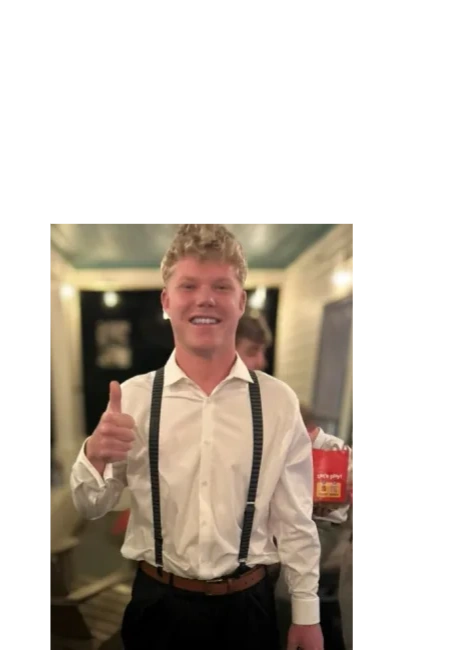 Wyatt smiling with a thumbs up.