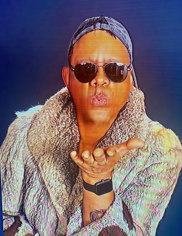 A man wearing sunglasses and a fur coat