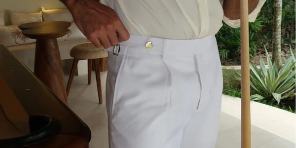 White trousers with gold button