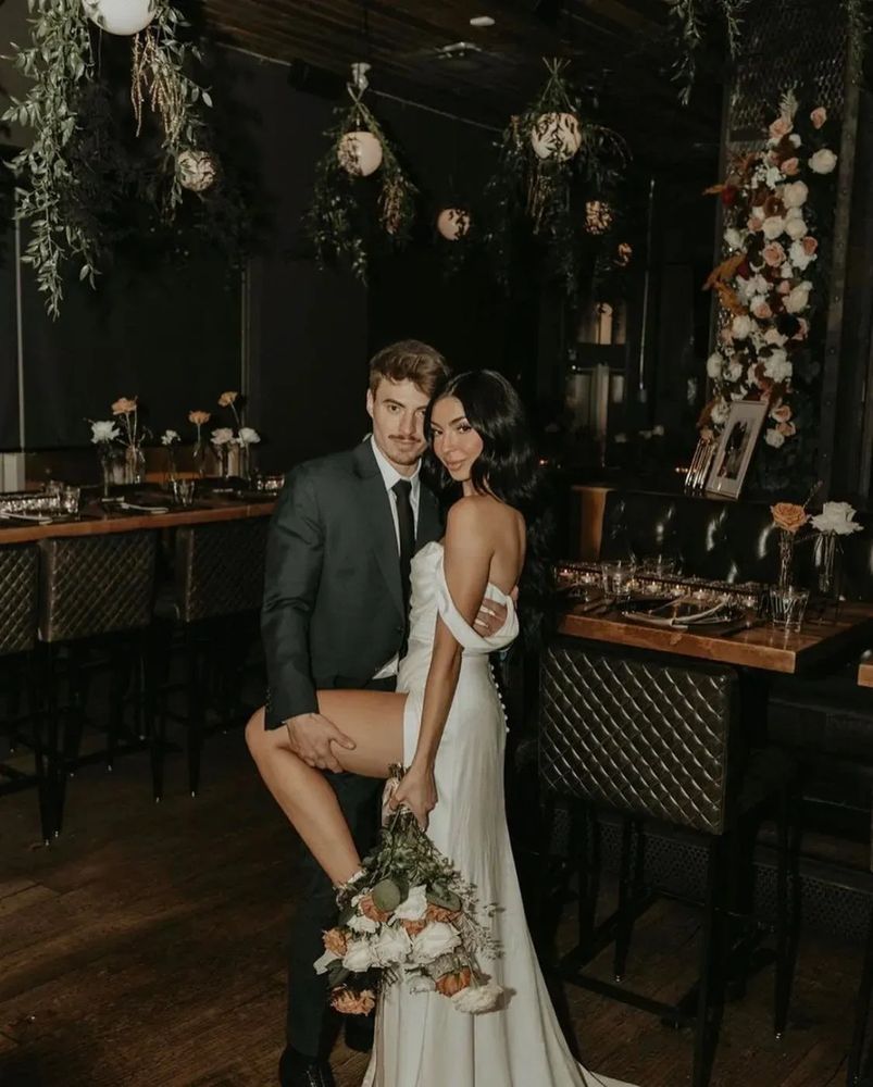 Groom wearing custom wedding suit in an intimate indoor setting in Edmonton.