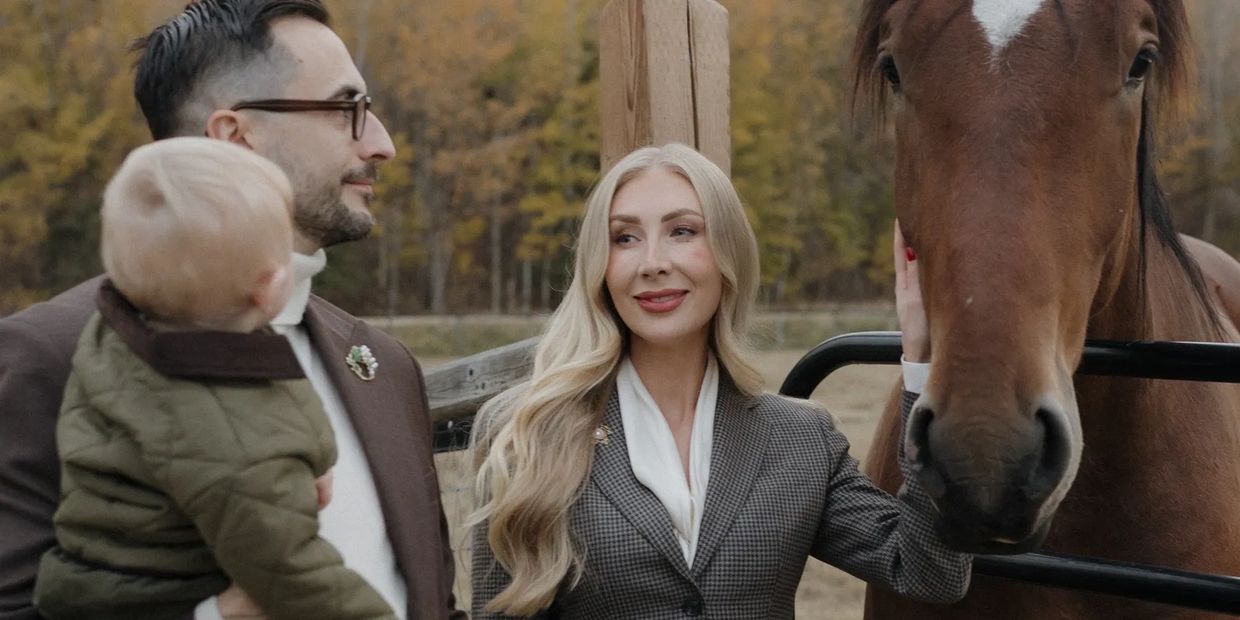 Family wearing Conxeppt clothing and posing with a horse
