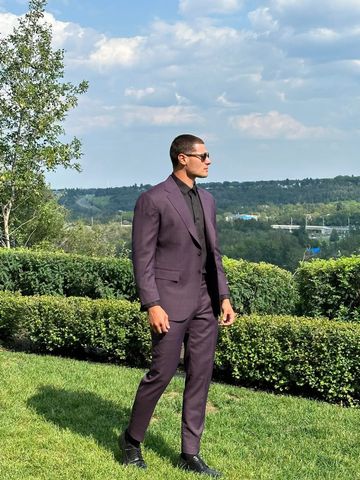 Man wearing a custom purple suit outdoors in Edmonton.