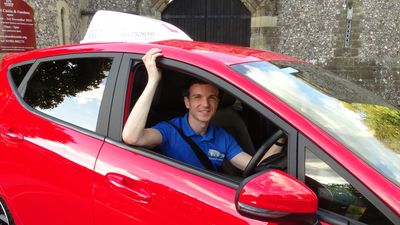 man sitting in car
