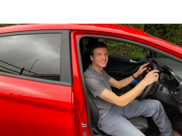 Daniel sitting in car