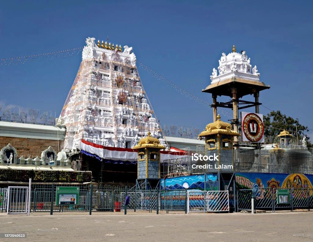 Tirupati Balaji temple entrance with clear blue sky.