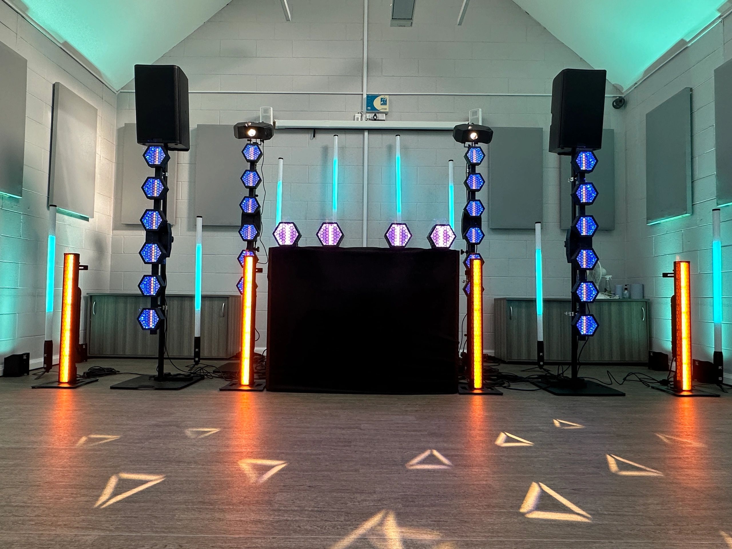 Colorful stage lighting setup in a room.