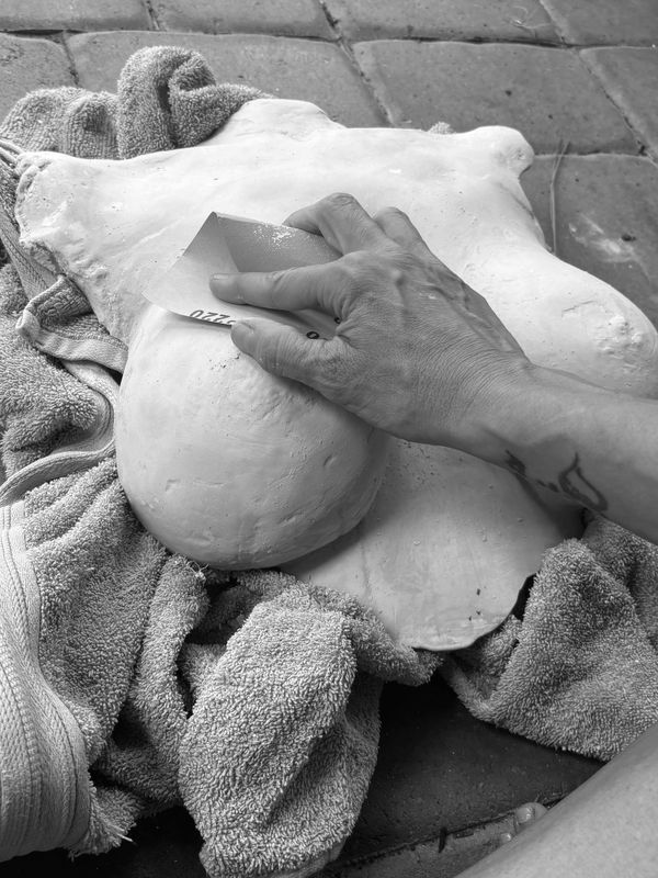 Sanding and smoothing the plaster 