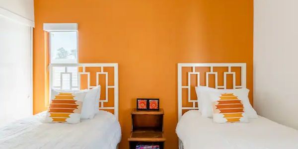 Twin bedroom in classic Palm Springs orange design.