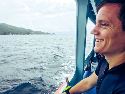 SCUBA diver looks at the water from the dive boat.