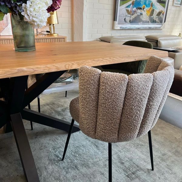dinning table and chairs with vase on the table