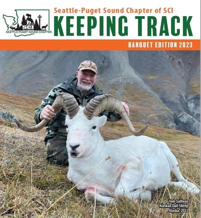 Hunter with a large Alaskan Dall Sheep in a mountainous area.