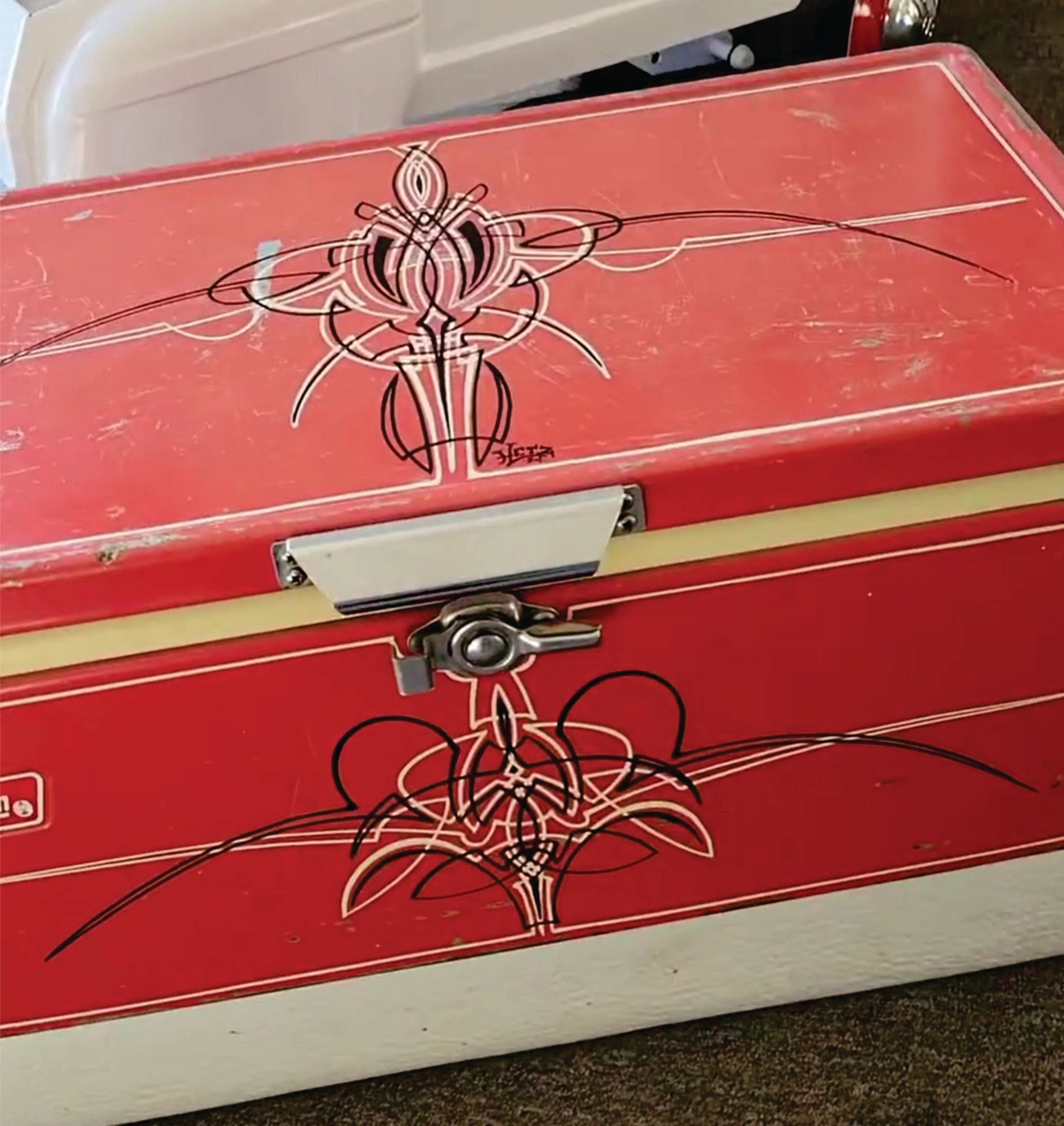 Pinstriping on a vintage cooler.