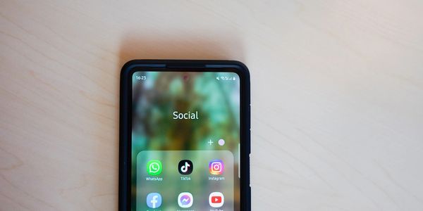 Mobile phone with social media app icons onscreen