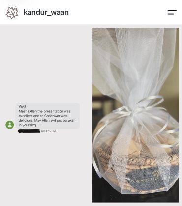 Gift basket wrapped in white netting with a positive message about a presentation.
