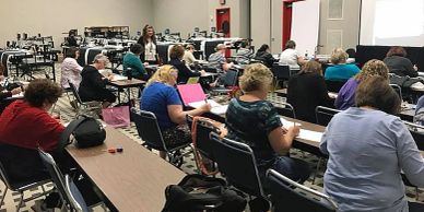 People attending a seminar in a conference room.