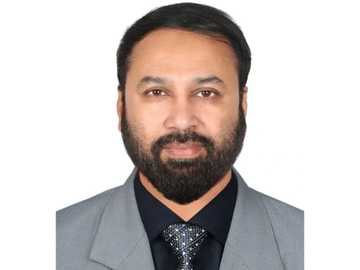 Portrait of a man in formal attire.