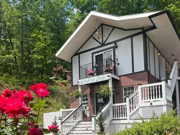 Exterior, springtime picture of this mountain-style bed and breakfast