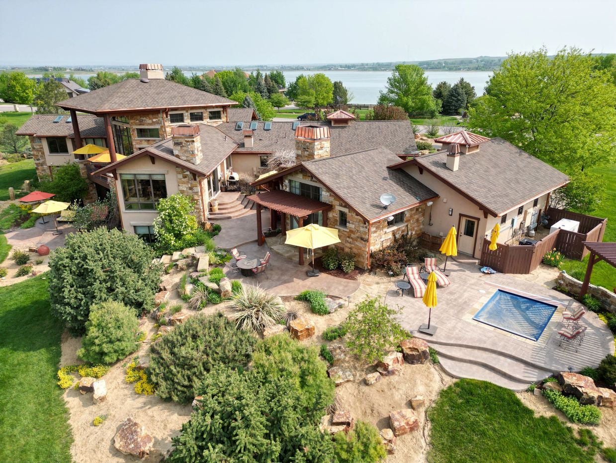 aerial picture of luxury lakefront home with pool