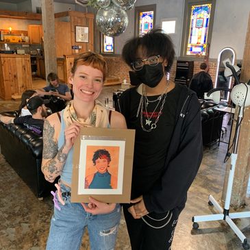 Two individuals standing before a digital design- a portrait created by the person on the right. 