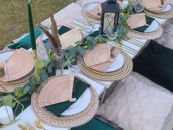 A large picnic table setting outdoors.