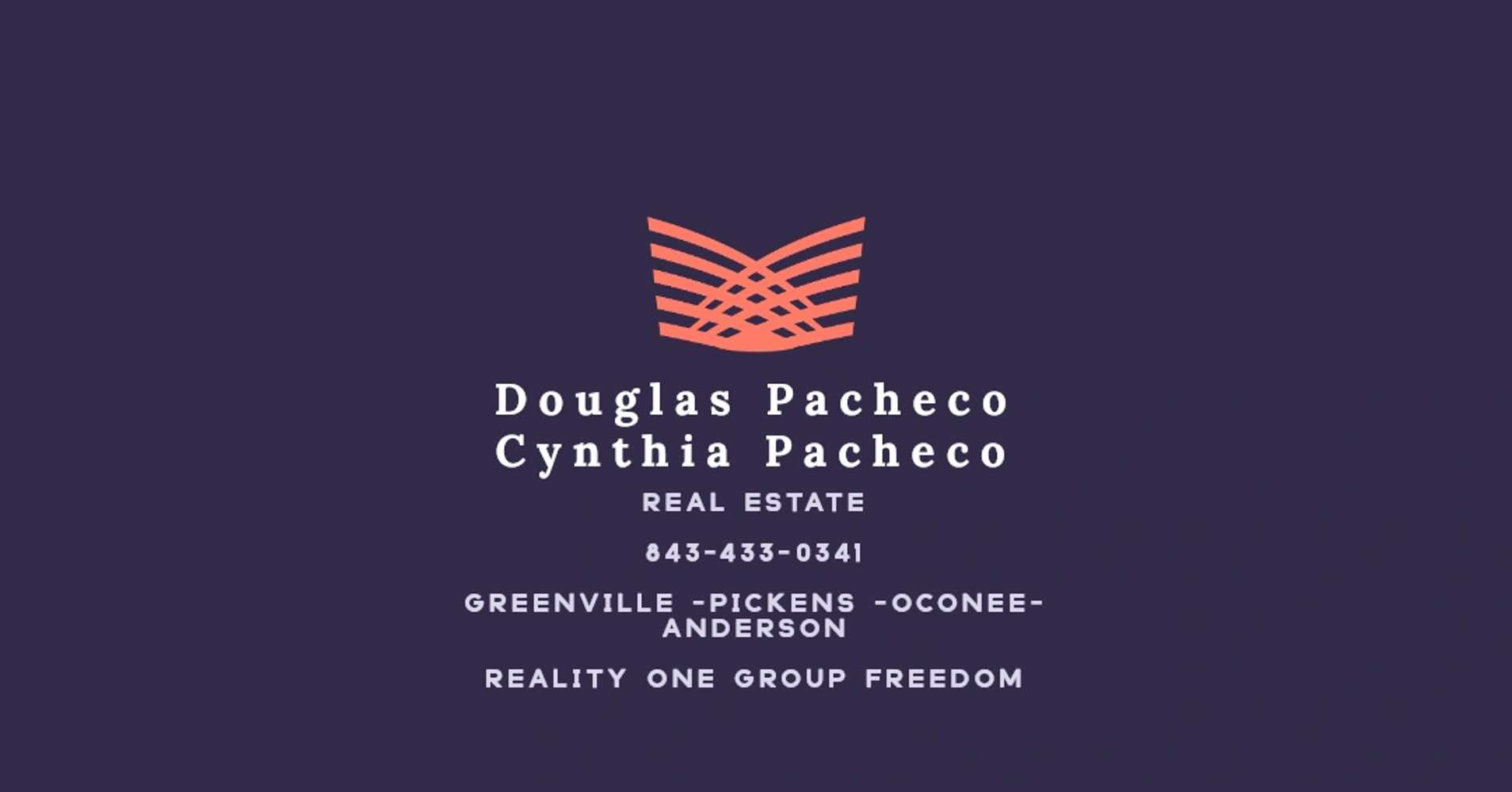 A charming gray house on a grassy hill by the ocean under a clear blue sky.