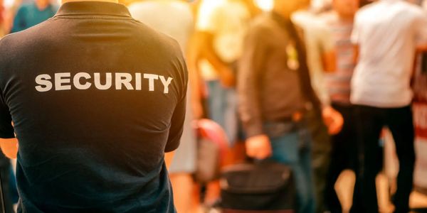 Security personnel monitoring a crowded event.