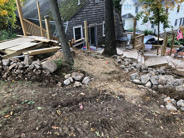 Laying the ground work for a multi platform deck stair entryway grill space patio koi pond waterfall