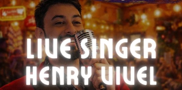 Live singer Henry Viuiel performing with a microphone.