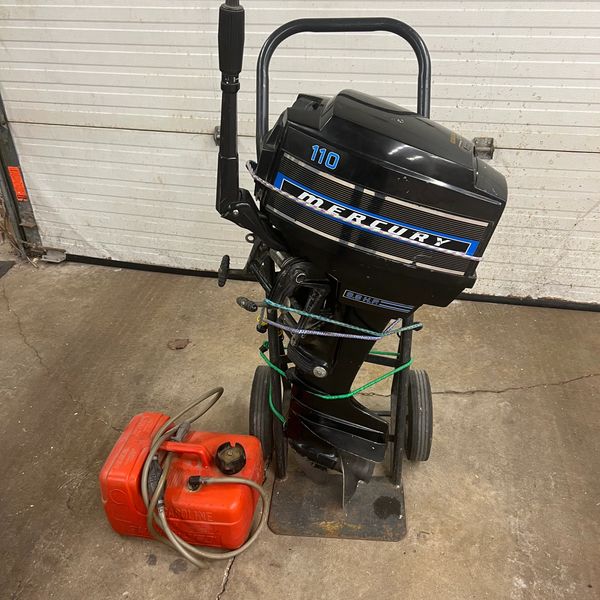 Black Mercury 110 outboard motor with red fuel tank.