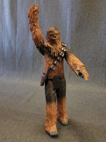 Chewbacca action figure raising one arm.