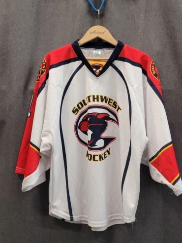 Southwest Hockey team jersey hanging on a hanger.
