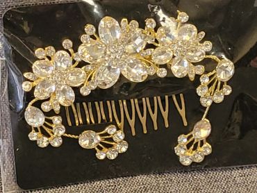 Ornate hair comb adorned with floral crystal design.