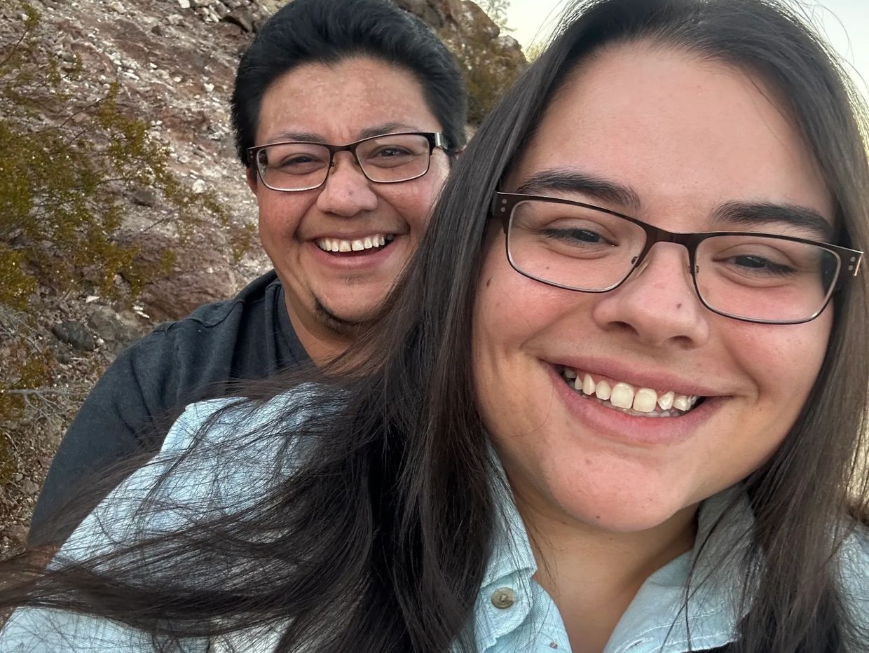 Jacq and Joseph smiling outdoors