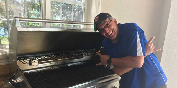 Happy Customer thrilled to have The Grill Cleaning Company cleaning his grill for him.