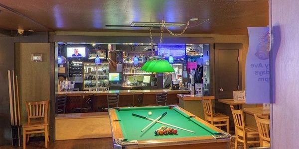 Pool tables inside Greeley Avenue Bar & Grill in the Shipyard District of Portland