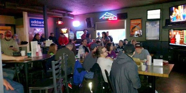 Group of friends at Greeley Avenue Pub Portland bar