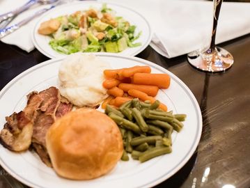 Plates with dinner and salad