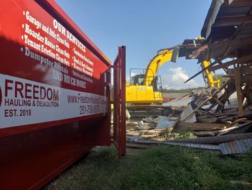 30k Excavator, removing debris from Storage Demolition site in Richmond texas