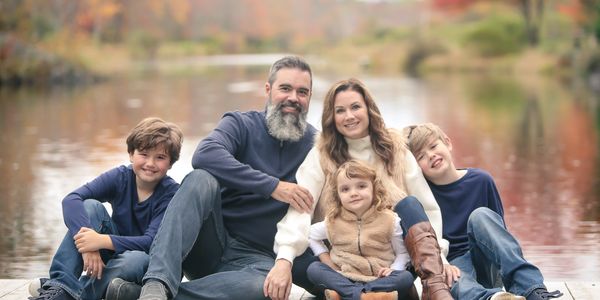 The Murphy family sitting by the lake