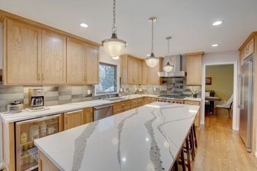 Kitchen remodel with white oak cabinets and Cambria Annika quartz