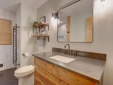 Richfield MN bath remodel with soapstone counter and black hex tiles