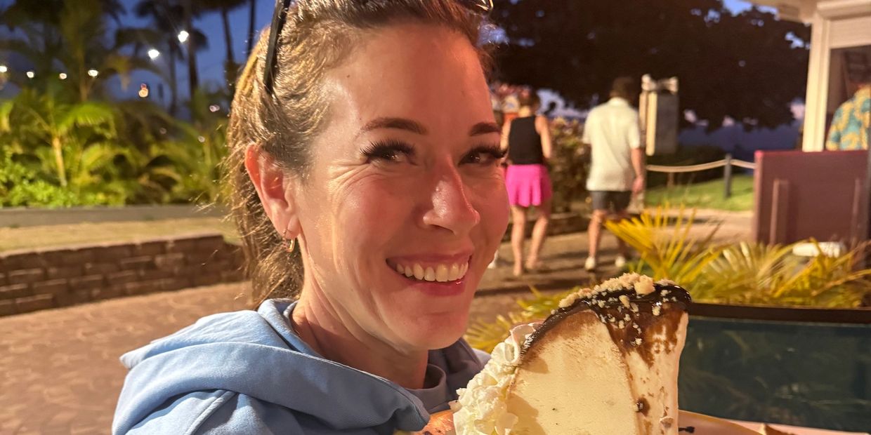 Heather, Founder of A Bite or Two doing one of her favorite things- eating delicious food in beautif