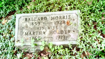 Gravestone of Ballard Morris and his wife Martha Holder surrounded by grass.