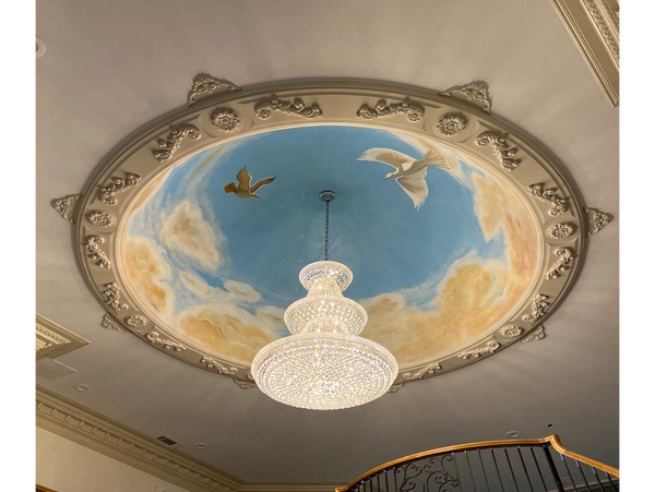 600pc chandelier install with handcrafted trim and custom artistry work on 24 foot ceiling