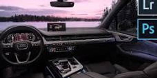 Modern car interior with dashboard view during sunset.