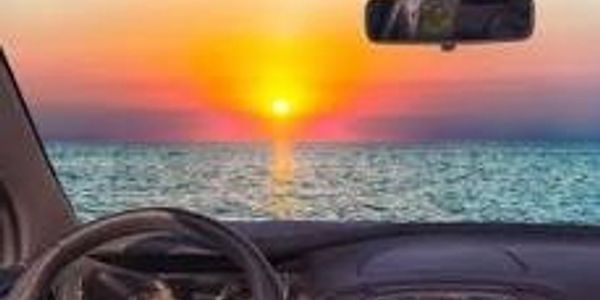 Sunset view from inside a car.