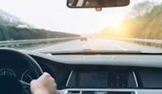 Driving on a sunlit highway.