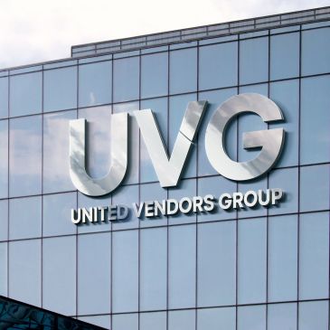 UVG United Vendors Group logo on building glass.