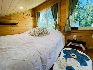 A snug loft retreat with a comfy queen mattress.